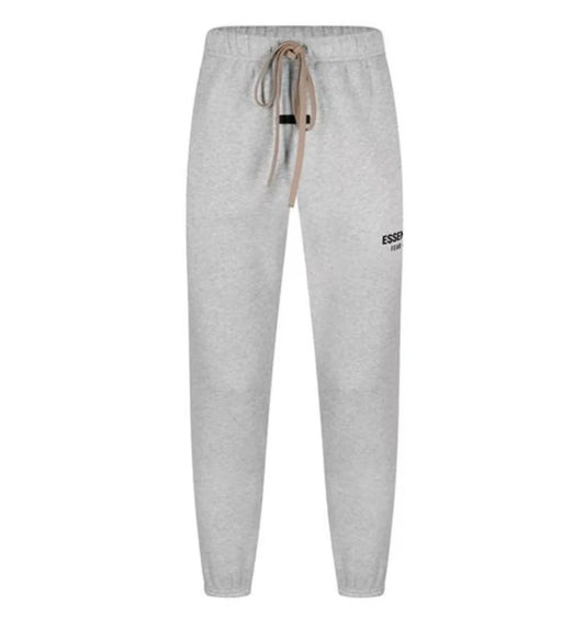 FEAR OF GOD ESSENTIALS LOGO SWEAT PANT DARK HEATHER OAT FW24